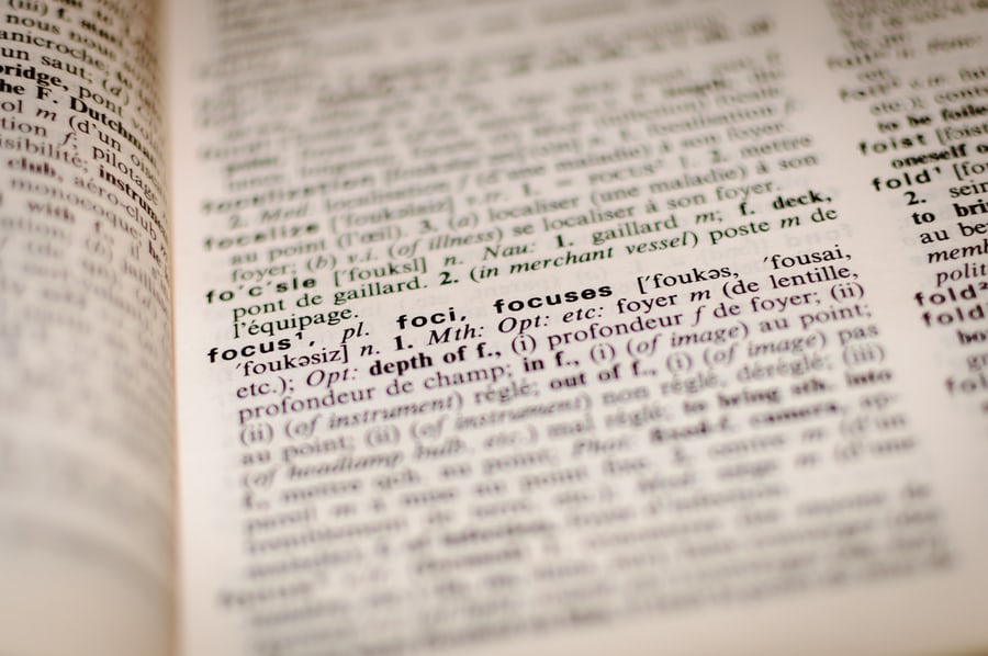 Close-up of dictionary page highlighting the word "focus.