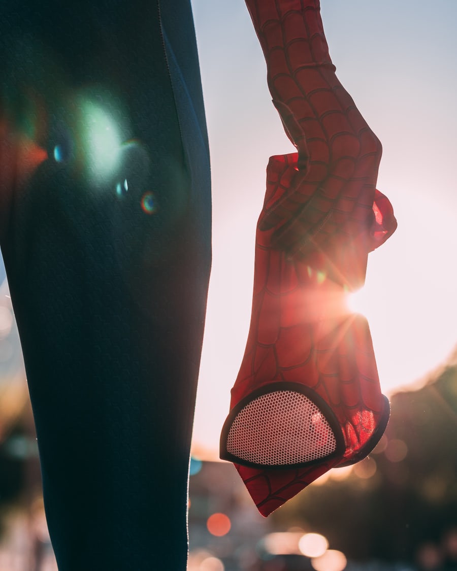 Spider-Man mask hanging in sunset light.