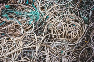 Tangled heap of weathered ropes and fishing nets.