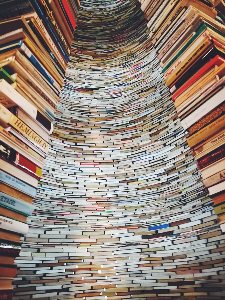 Towering spiral of stacked books.