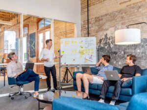 Team meeting with presentation in modern office setting.