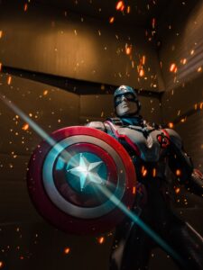 Captain America figure with shield under dynamic lighting.