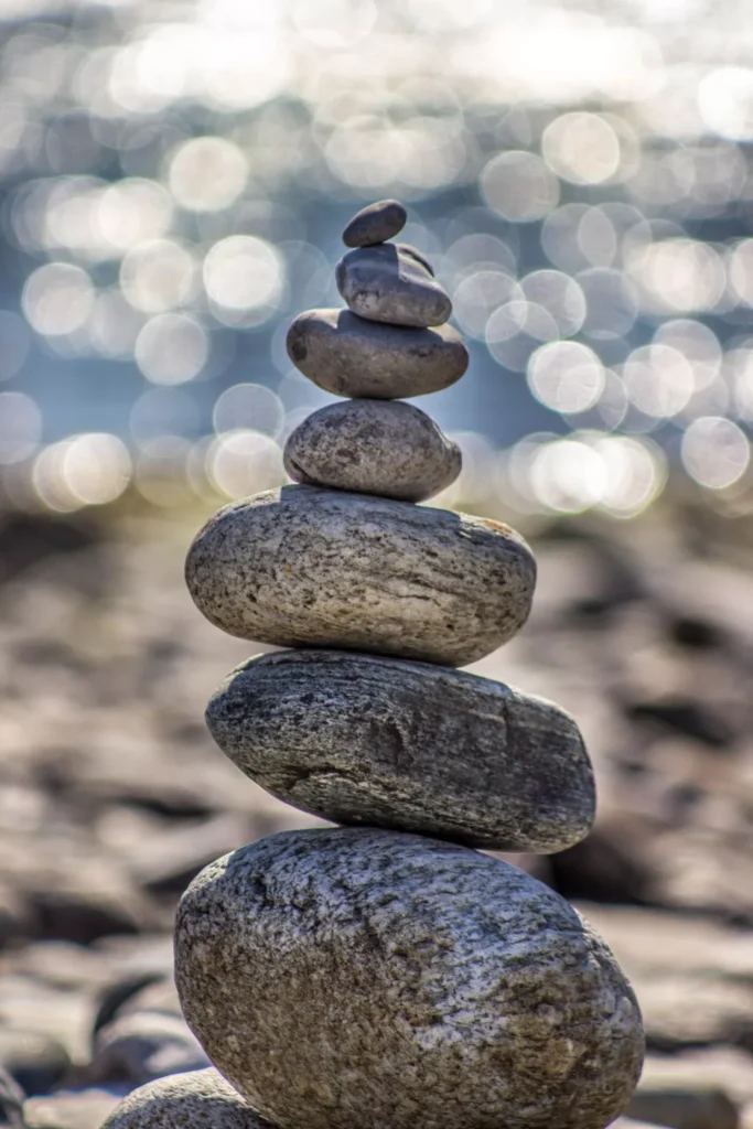 Zen stone stack with sparkling water background