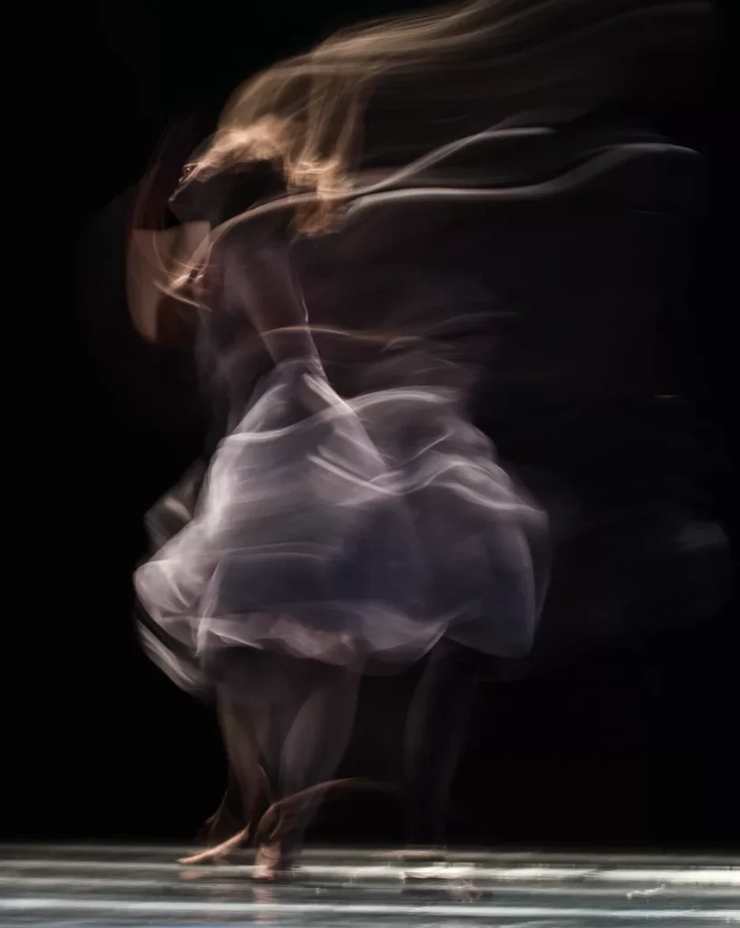 Blurred motion of dancer in ethereal performance