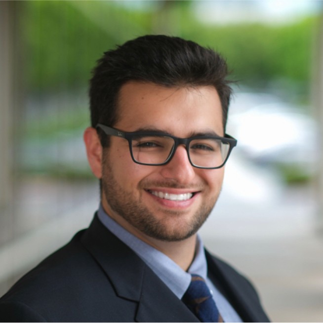 Smiling businessman in glasses outdoor