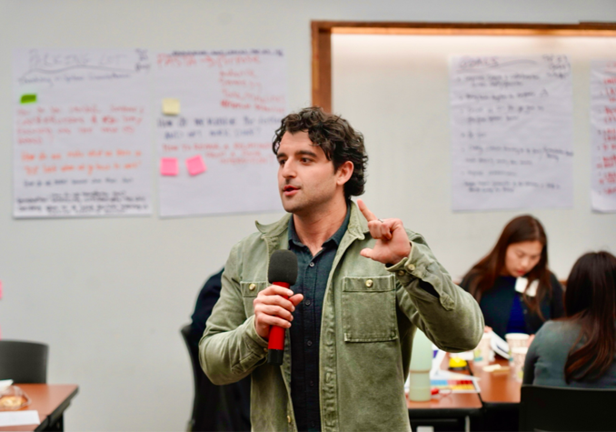Man presenting with microphone in workshop